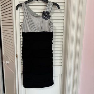 Amy’s Closet Girls size 12 Metallic Silver and Black Dress with Sequin Flower